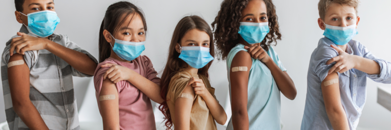 a group of girls wearing face masks
